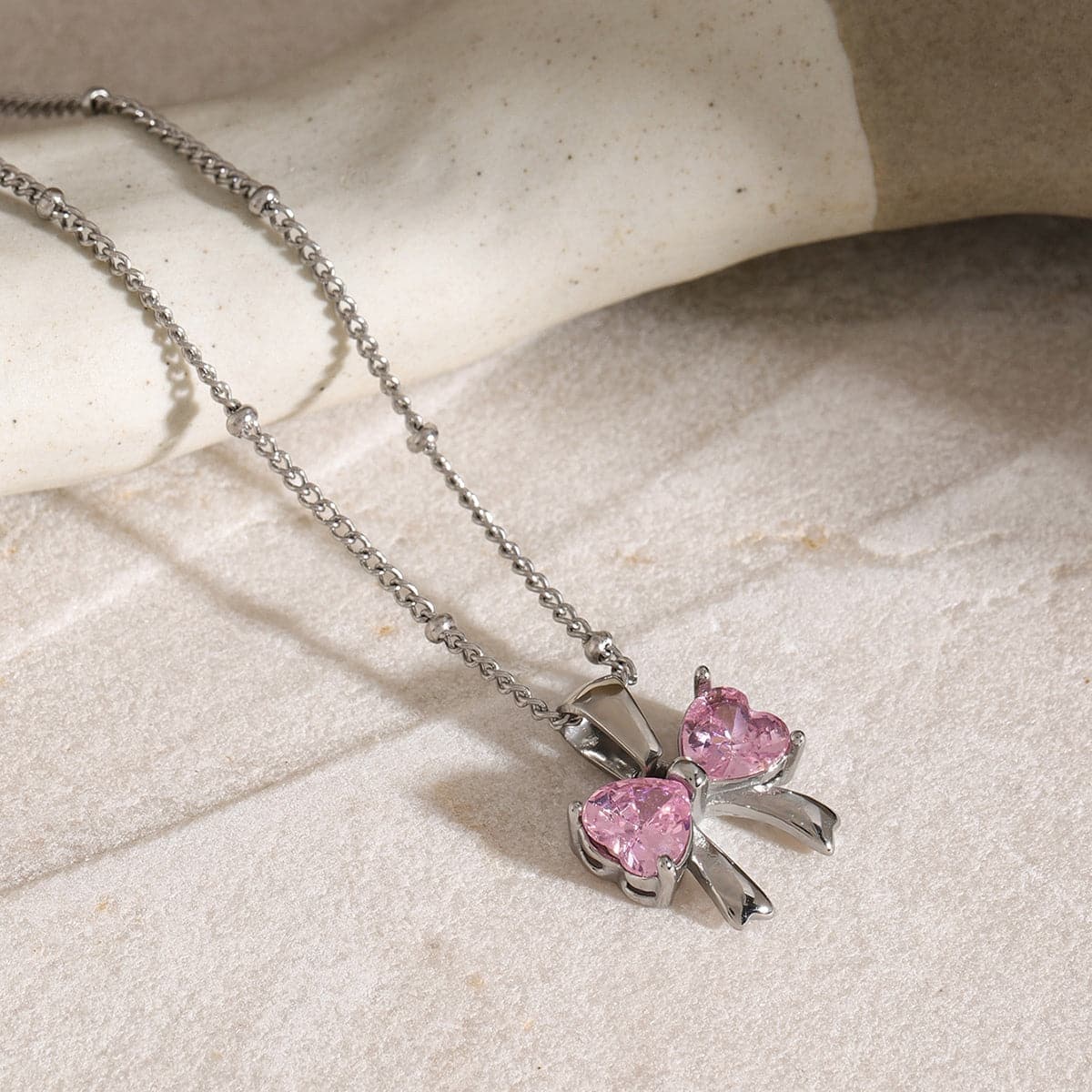 Elegant zircon and stainless steel bow necklace