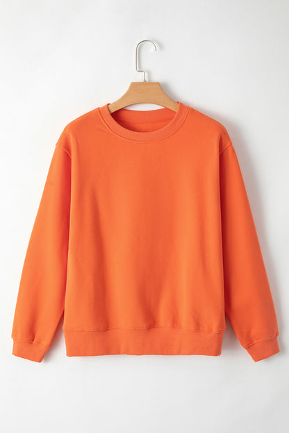 Cozy russet orange fleece-lined sweatshirt with drop shoulders