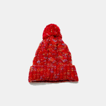 Cozy cable-knit beanie with playful pompom