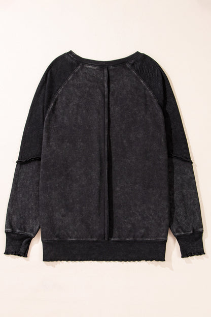 Chic black waffle knit raglan sleeve sweatshirt with patchwork detail