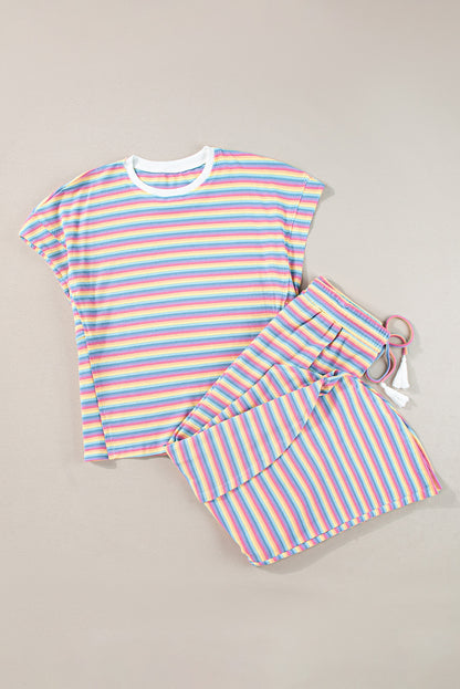 Chic pink striped rainbow tee and tasseled wide leg pants ensemble