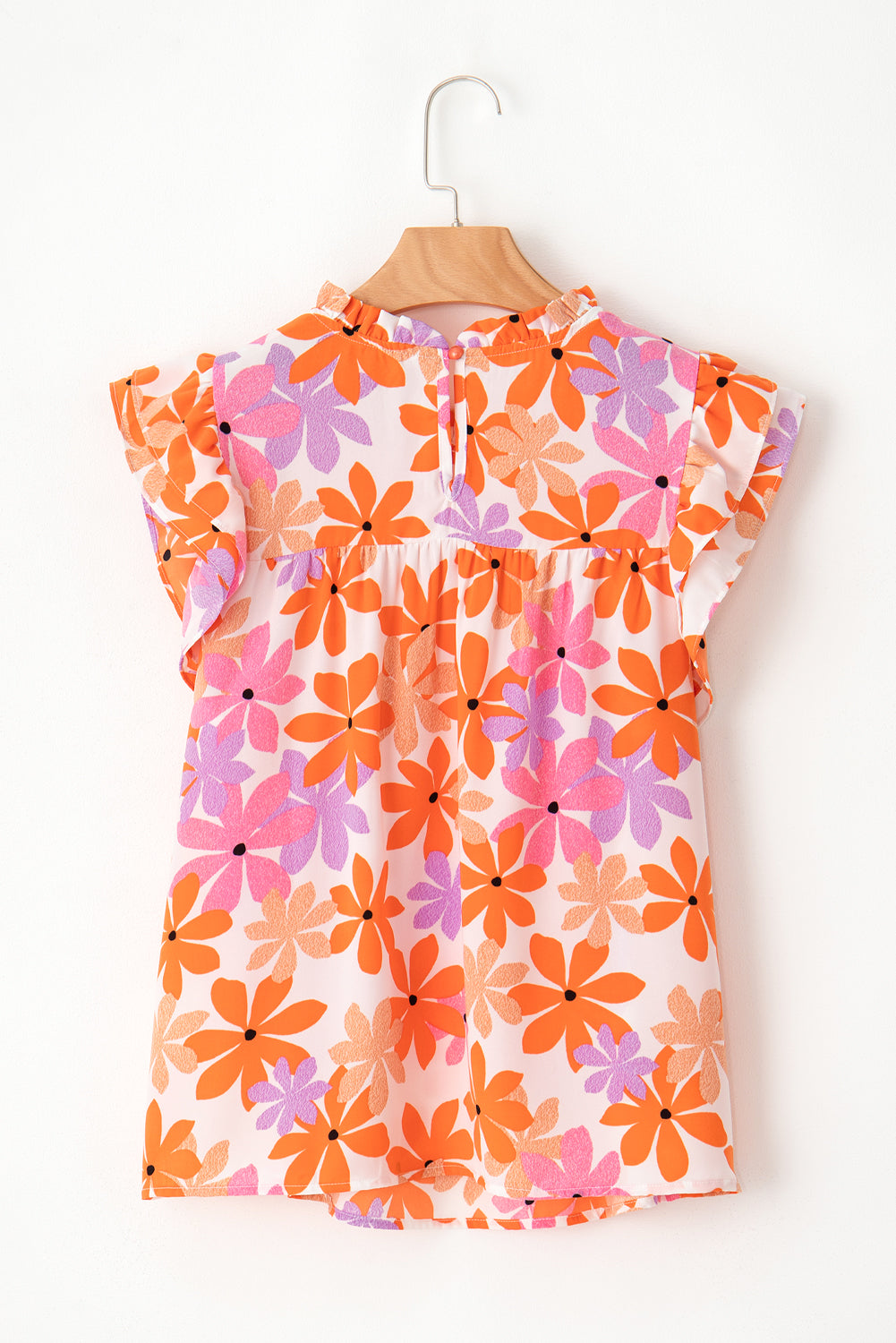 Floral delight: Orange ruffled sleeve top with smocked detail