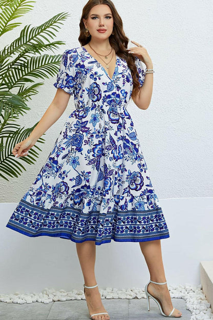 Floral midi dress with flounce sleeves and ruffle surplice neckline.