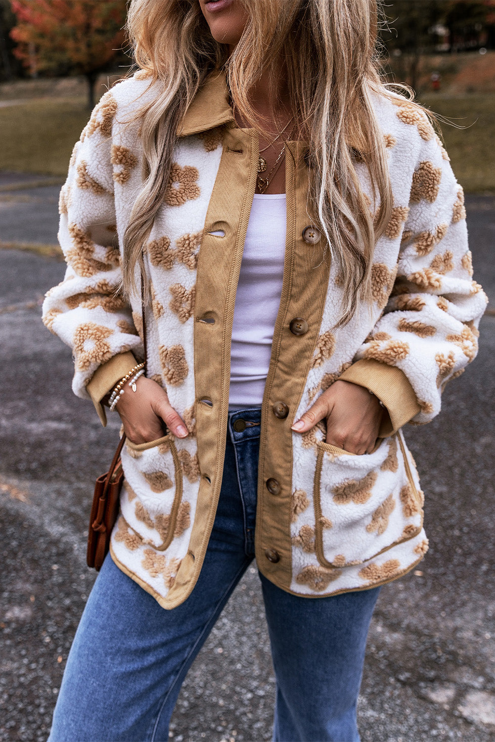 Charming beige fleece jacket with cute flower patterns and button-up design