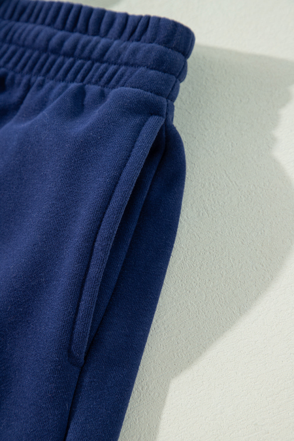 Navy blue fleece joggers with drawstring