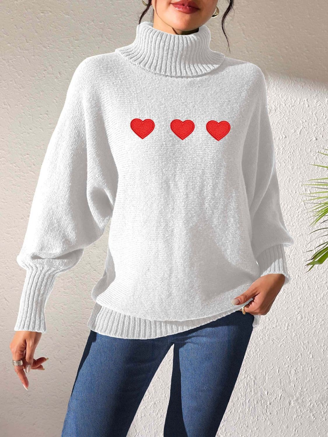 Charming heart-print turtleneck sweater