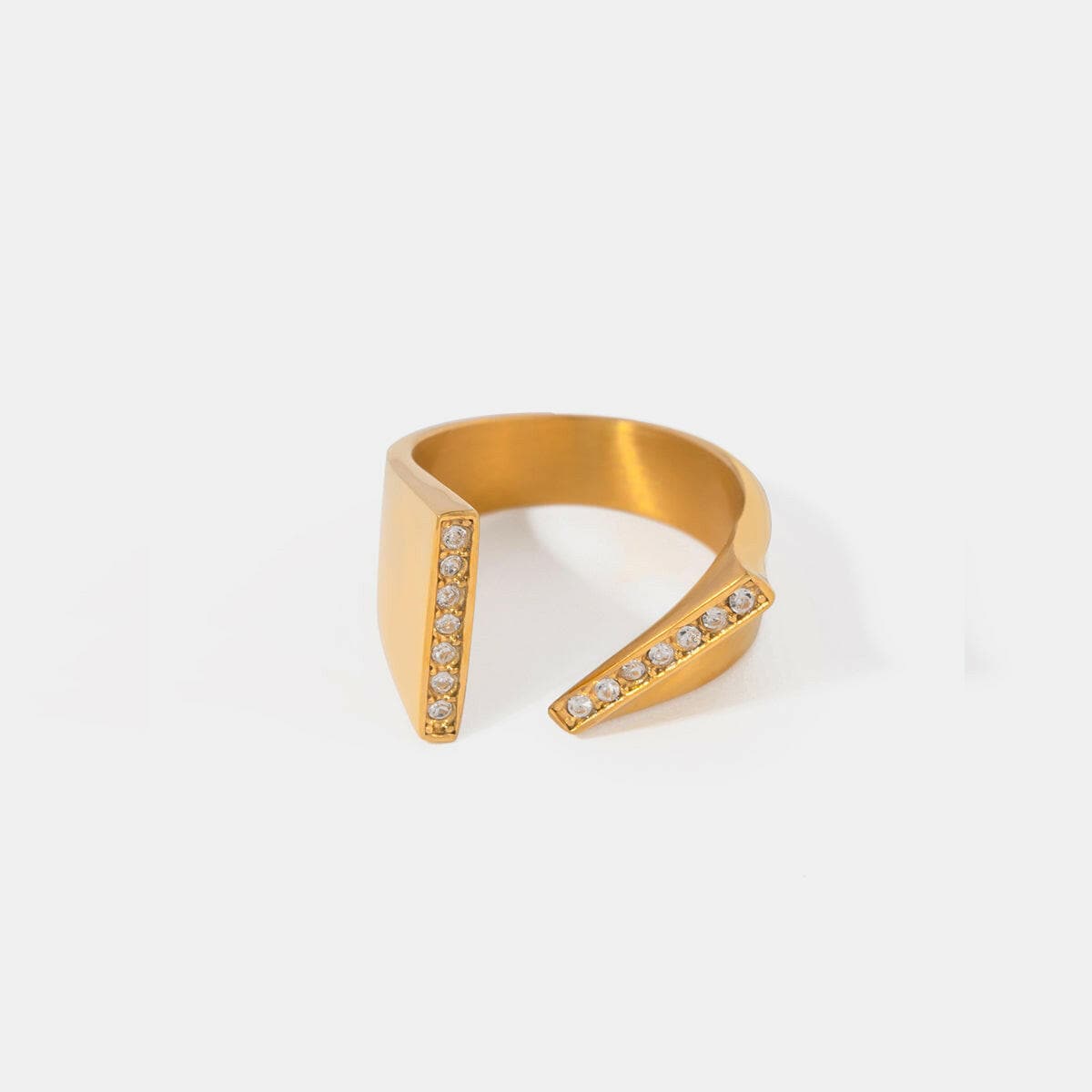 Asymmetrical gold-plated stainless steel open ring with rhinestones.