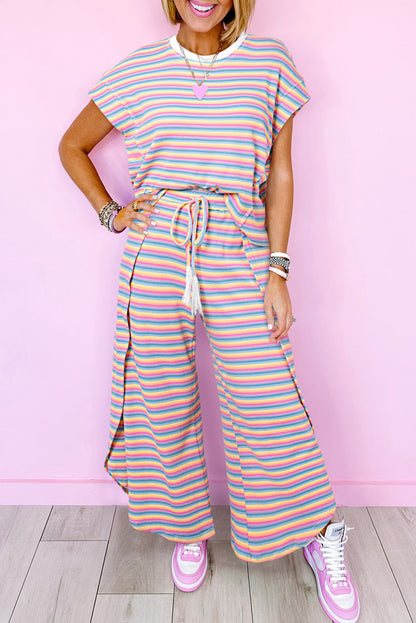 Chic pink striped rainbow tee and tasseled wide leg pants ensemble