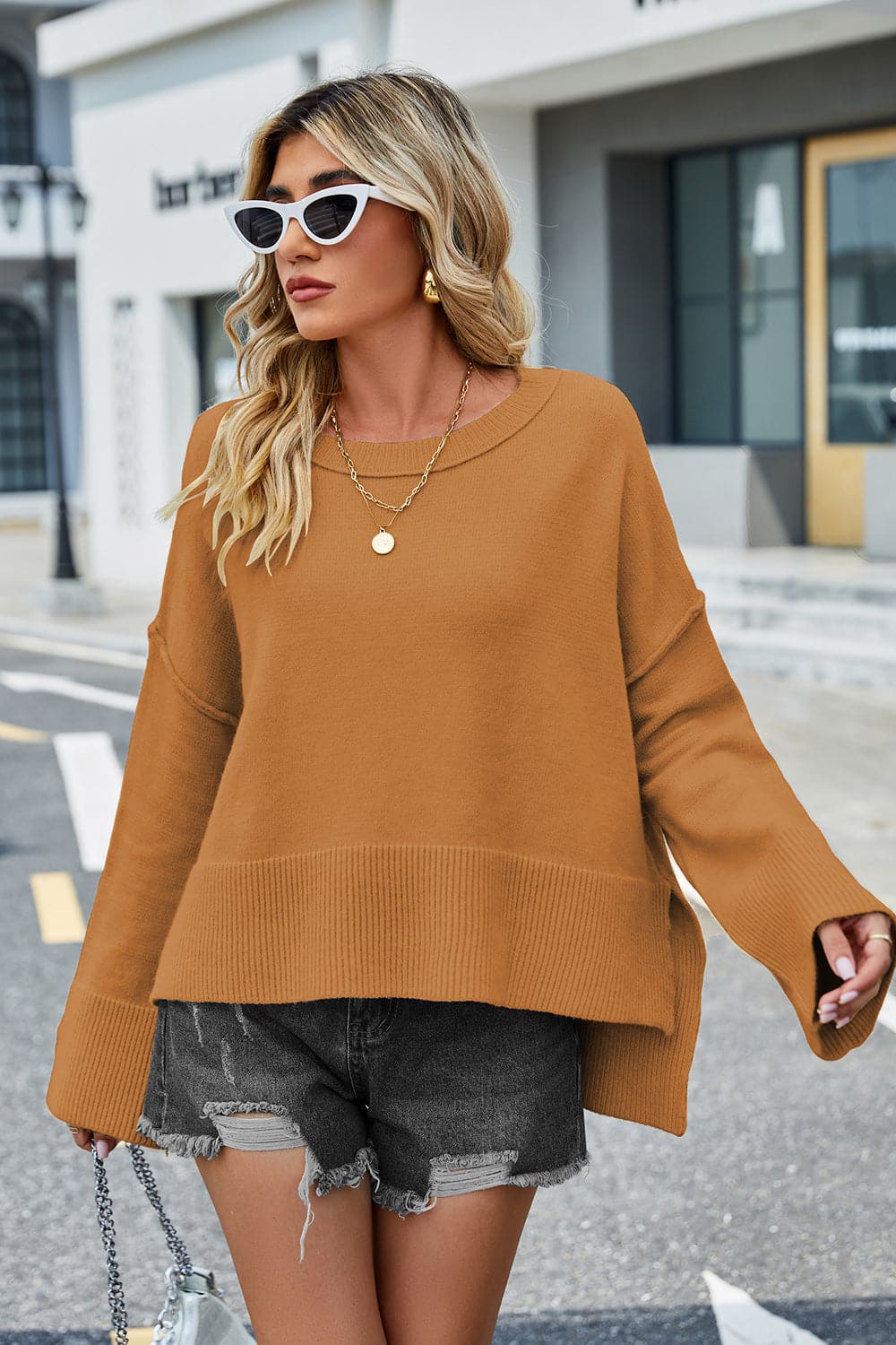 High-Low Slit Round Neck Long Sleeve Sweater.