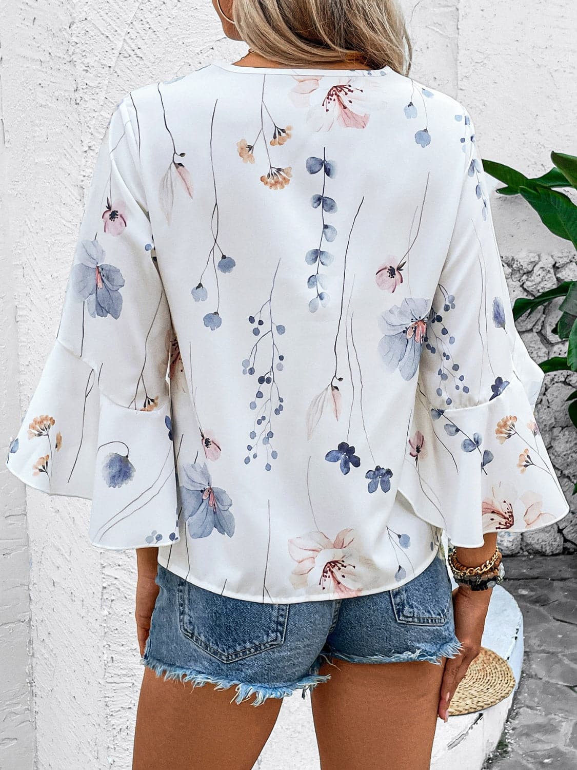 Ruffled Printed V-Neck Half Sleeve Blouse.