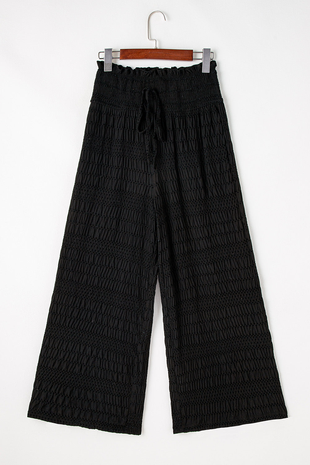 Relaxed black textured smocked waist wide-leg pants