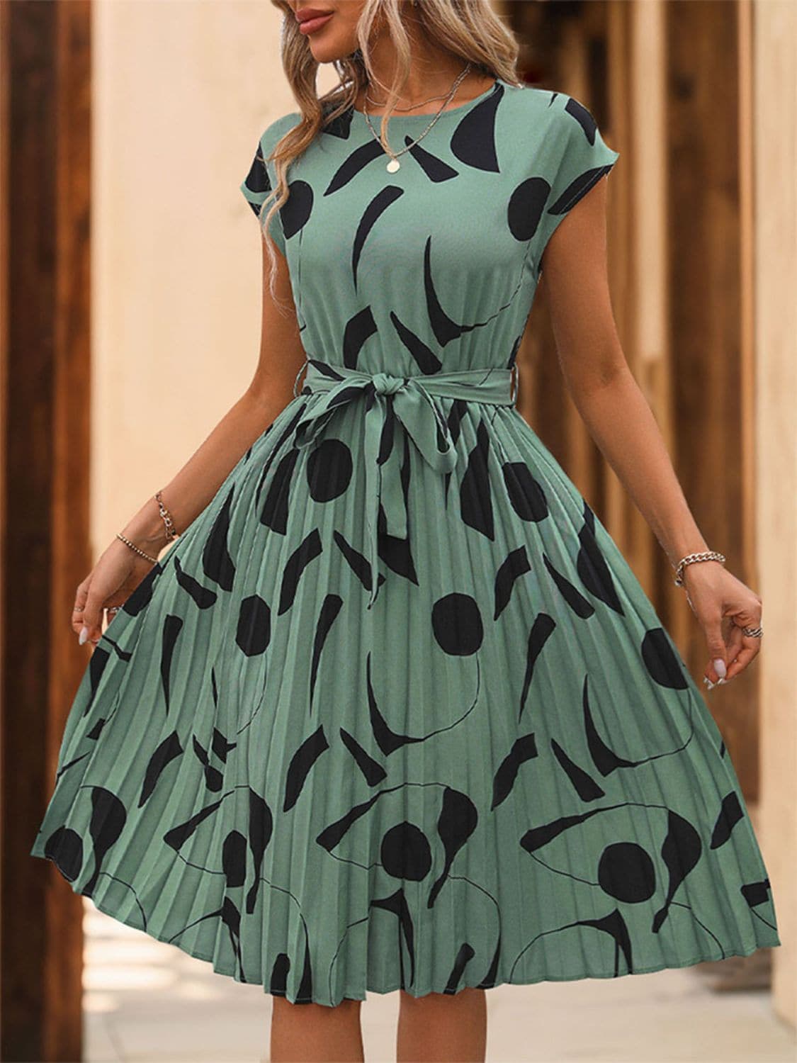 Tied Pleated Printed Cap Sleeve Dress.