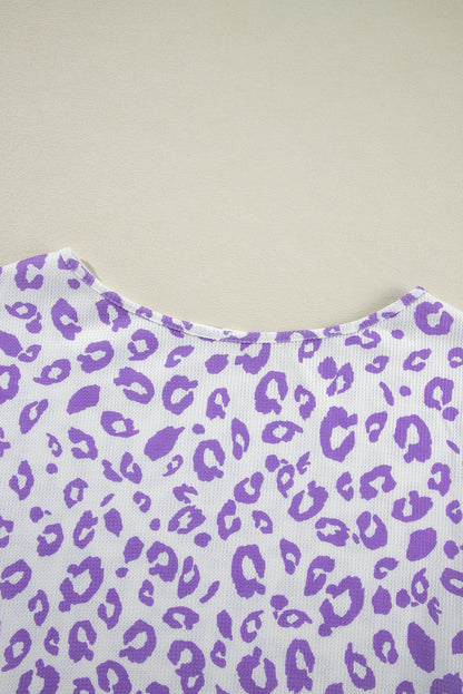 Cozy purple leopard print top with boat neck and drop shoulders