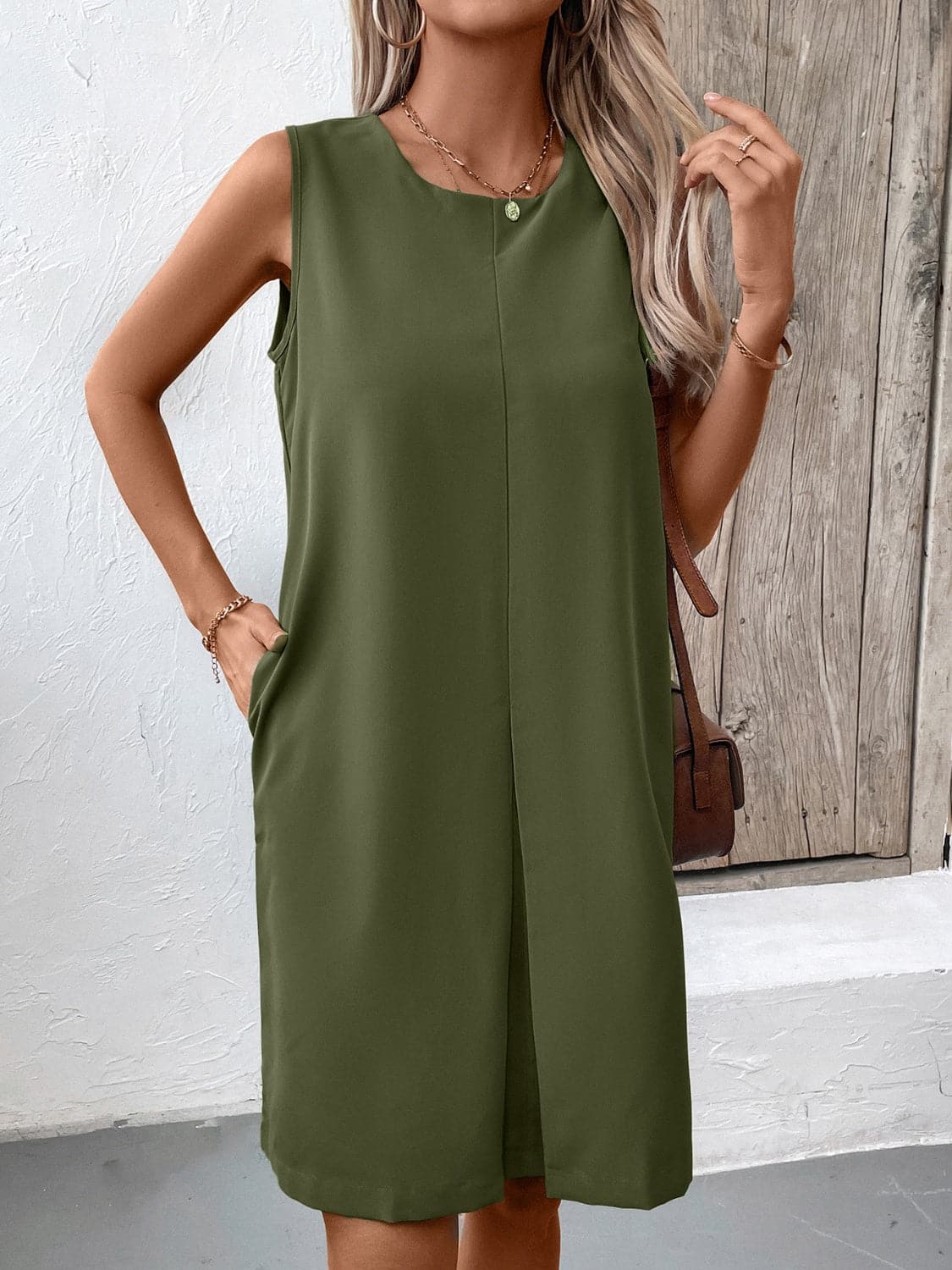 Pocketed Round Neck Sleeveless Mini Dress.