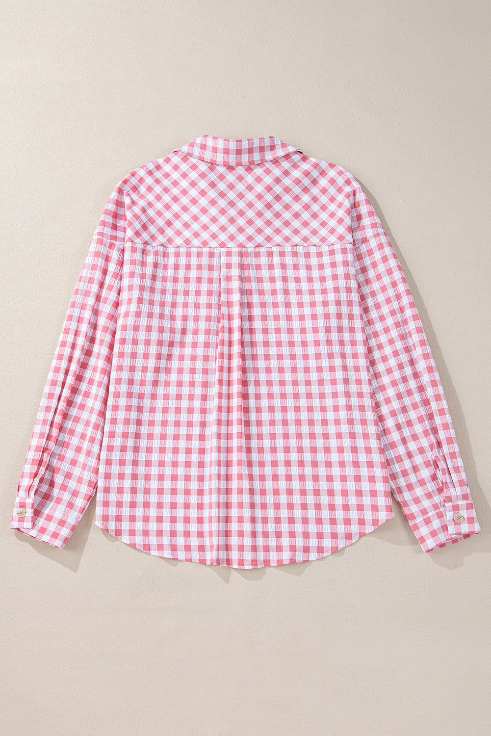 Chic pink gingham collared shirt with functional chest pockets