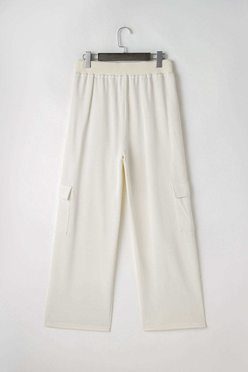 Beige high-waisted cargo sweatpants with pockets for casual comfort