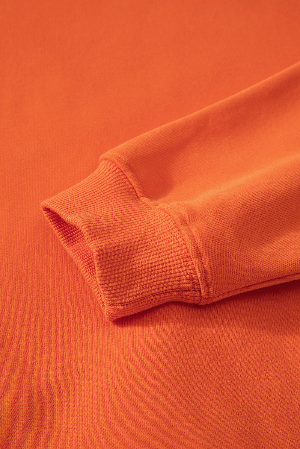 Cozy russet orange fleece-lined sweatshirt with drop shoulders