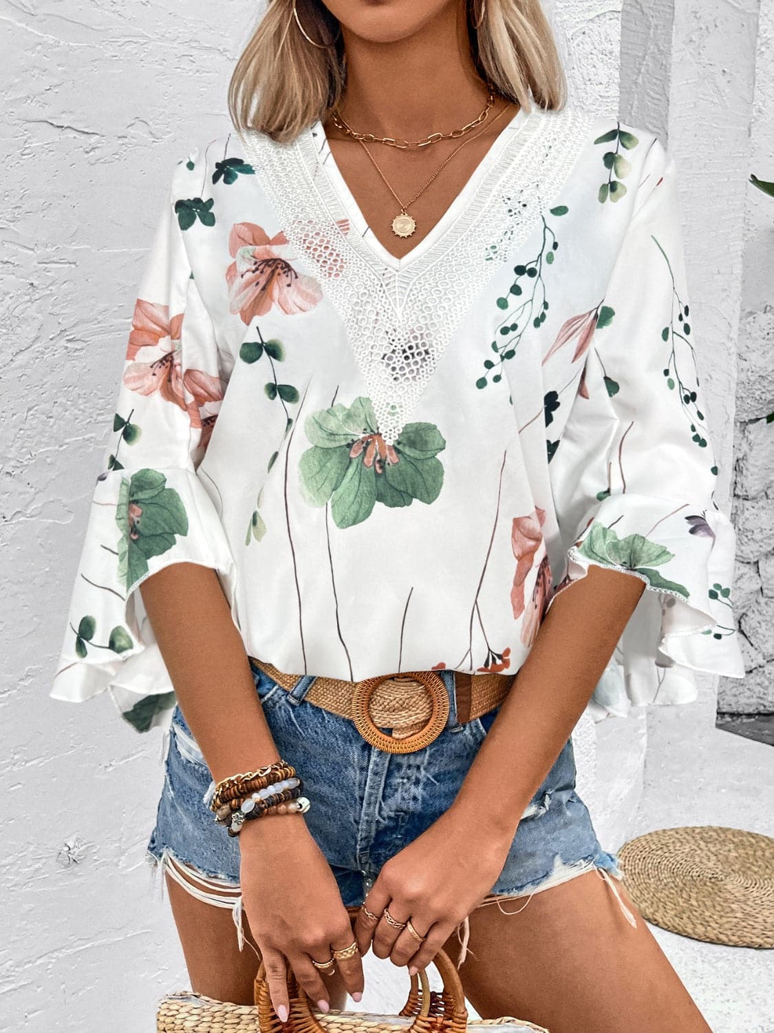 Ruffled Printed V-Neck Half Sleeve Blouse.