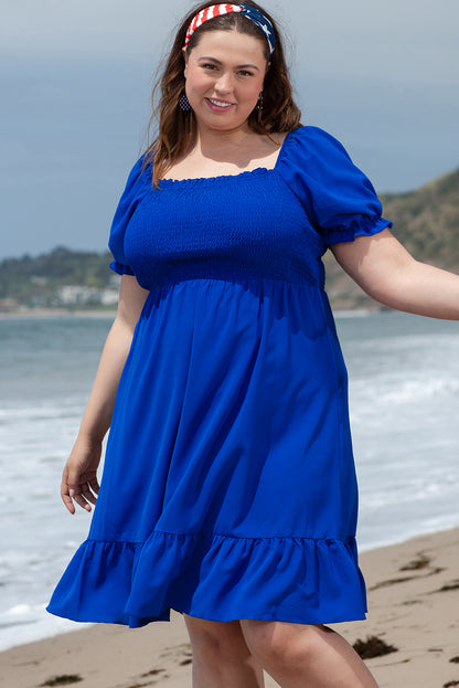 Flattering dark blue ruffled mini dress with square neckline for plus sizes