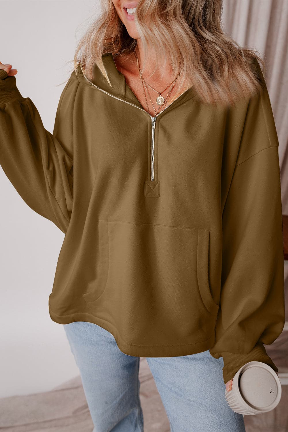 Pocketed Half Zip Dropped Shoulder Hoodie.