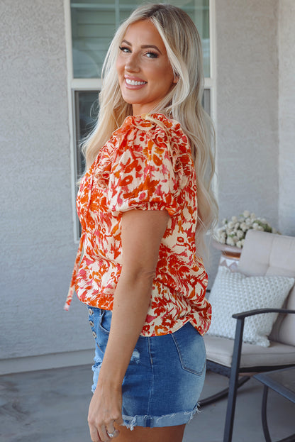 Vibrant Orange Ruffled Floral Blouse with Puff Sleeves and Split Neckline