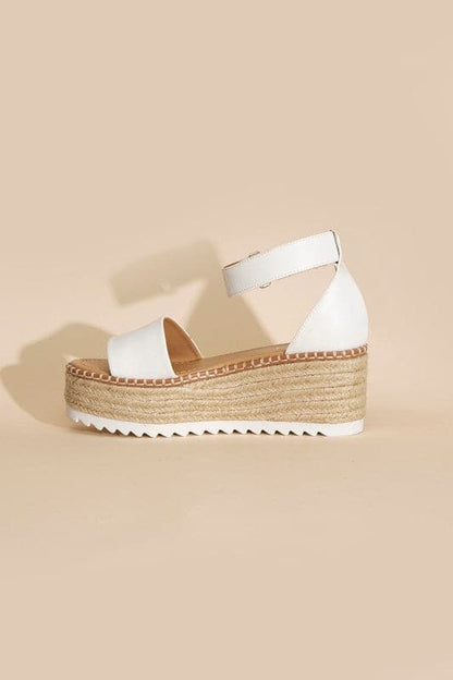 TUCKIN-S PLATFORM SANDALS.