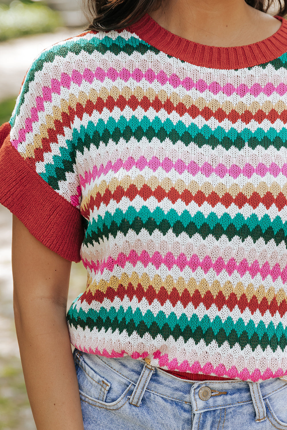 Colorful textured sweater with fiery red ruffle sleeves