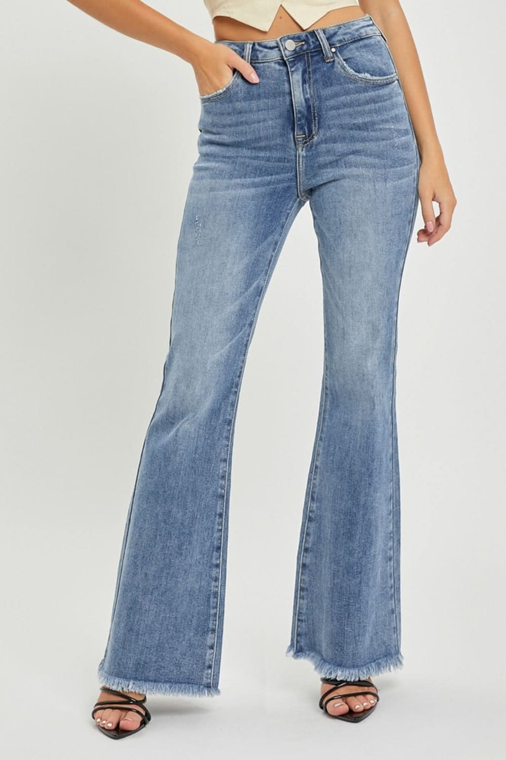 RISEN Full Size High Waist Raw Hem Flare Jeans with a retro-inspired design and raw hem detailing.