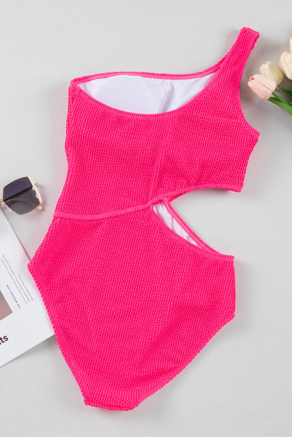 Bold bright pink textured one-shoulder monokini with cut-out design