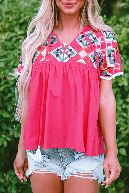 Chic strawberry pink geometric embroidered blouse with tassel tie neckline