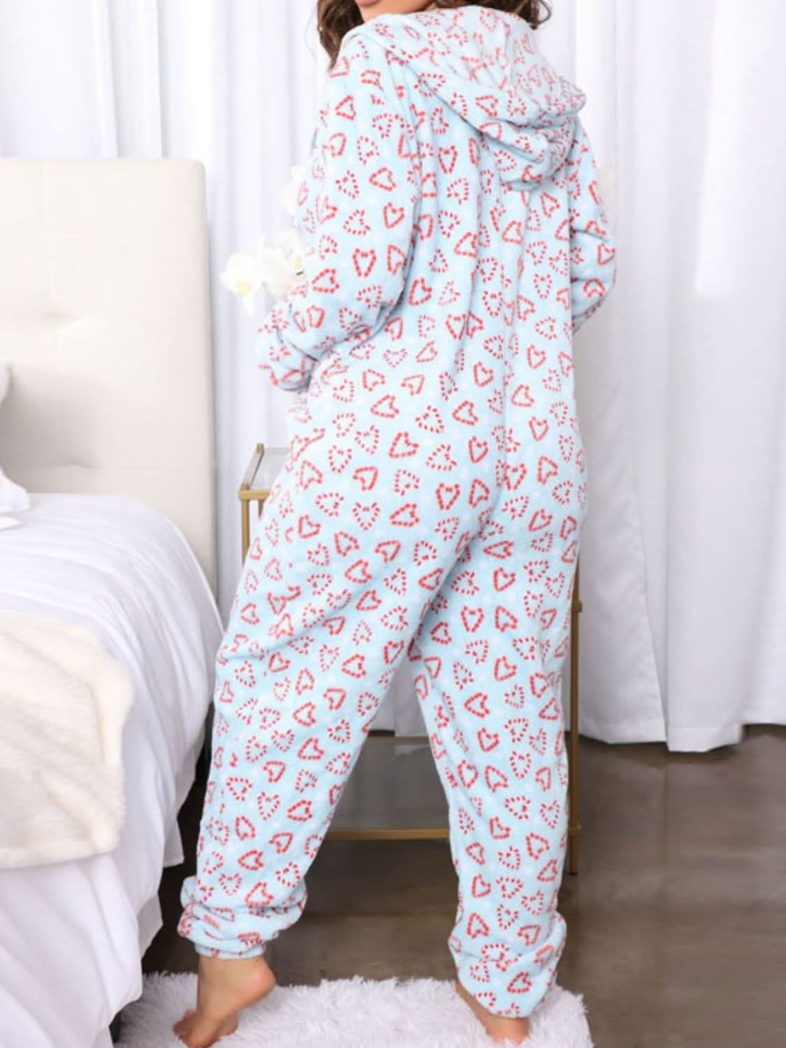 Chic printed hooded jumpsuit with pockets and stretch comfort