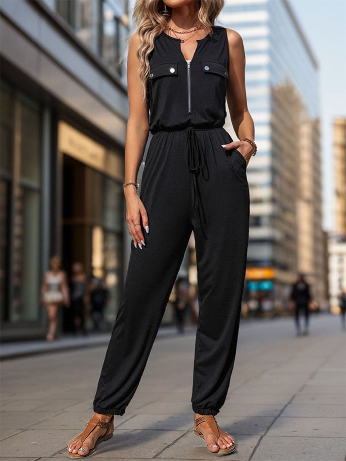 Half Zip Sleeveless Jumpsuit with Pockets.