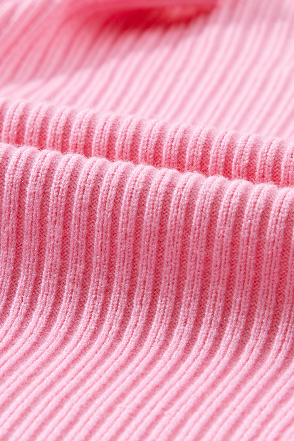 Cozy pink ribbed knit sweater with patch pocket and short sleeves