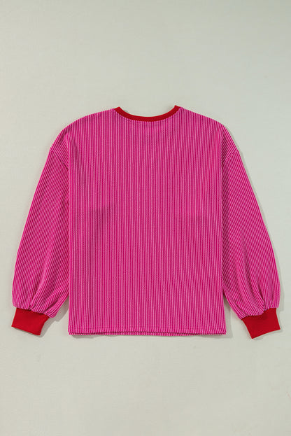 Vibrant pink corded edge drop shoulder long sleeve top