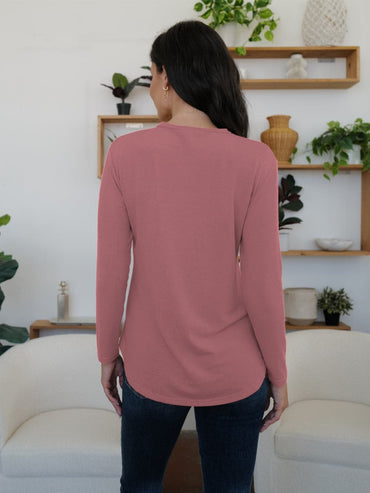 Stylish long sleeve tee with decorative buttons