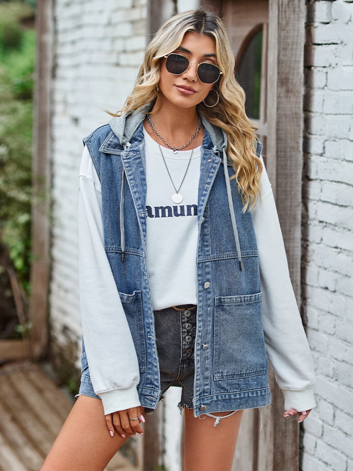 Button Up Sleeveless Denim Jacket with Pockets.