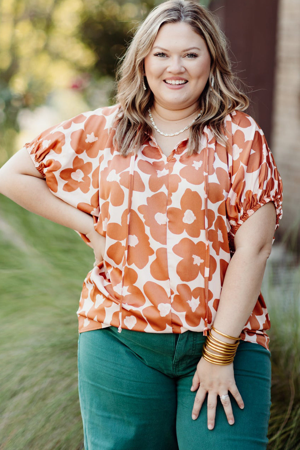 Floral Delight: Plus Size Orange V Neck Blouse with Drawstring Detail