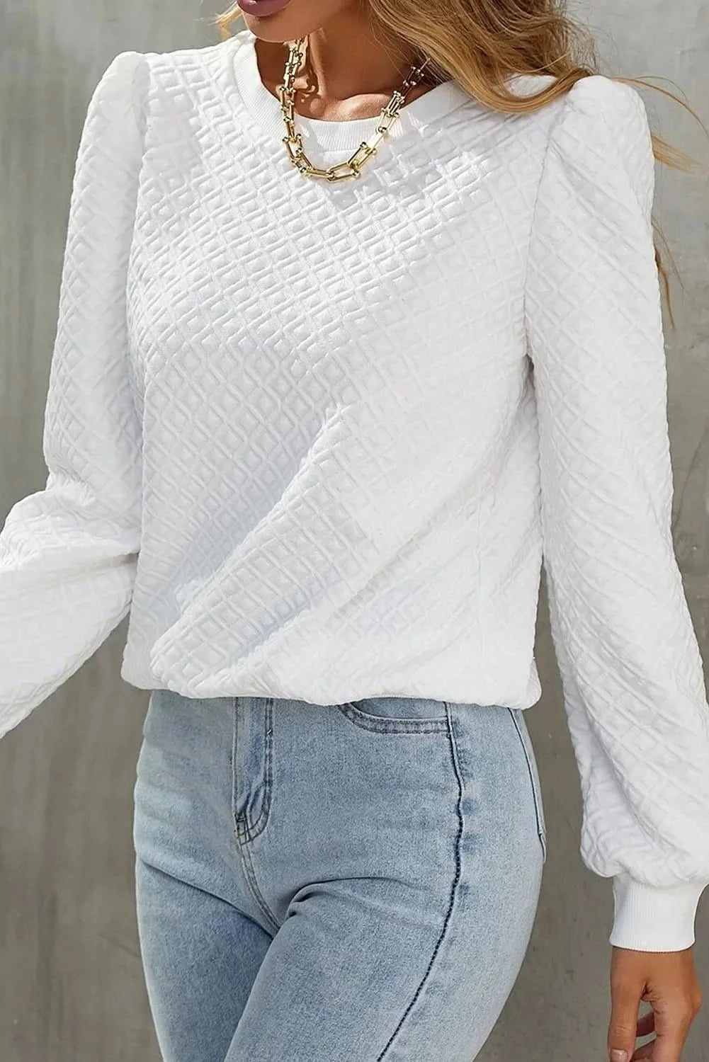 Textured long sleeve round neck top with a flattering fit