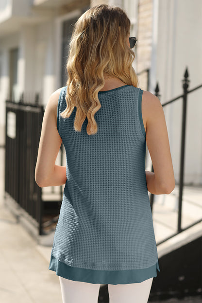 Teal flowy vest with scoop neckline and waffle knit texture