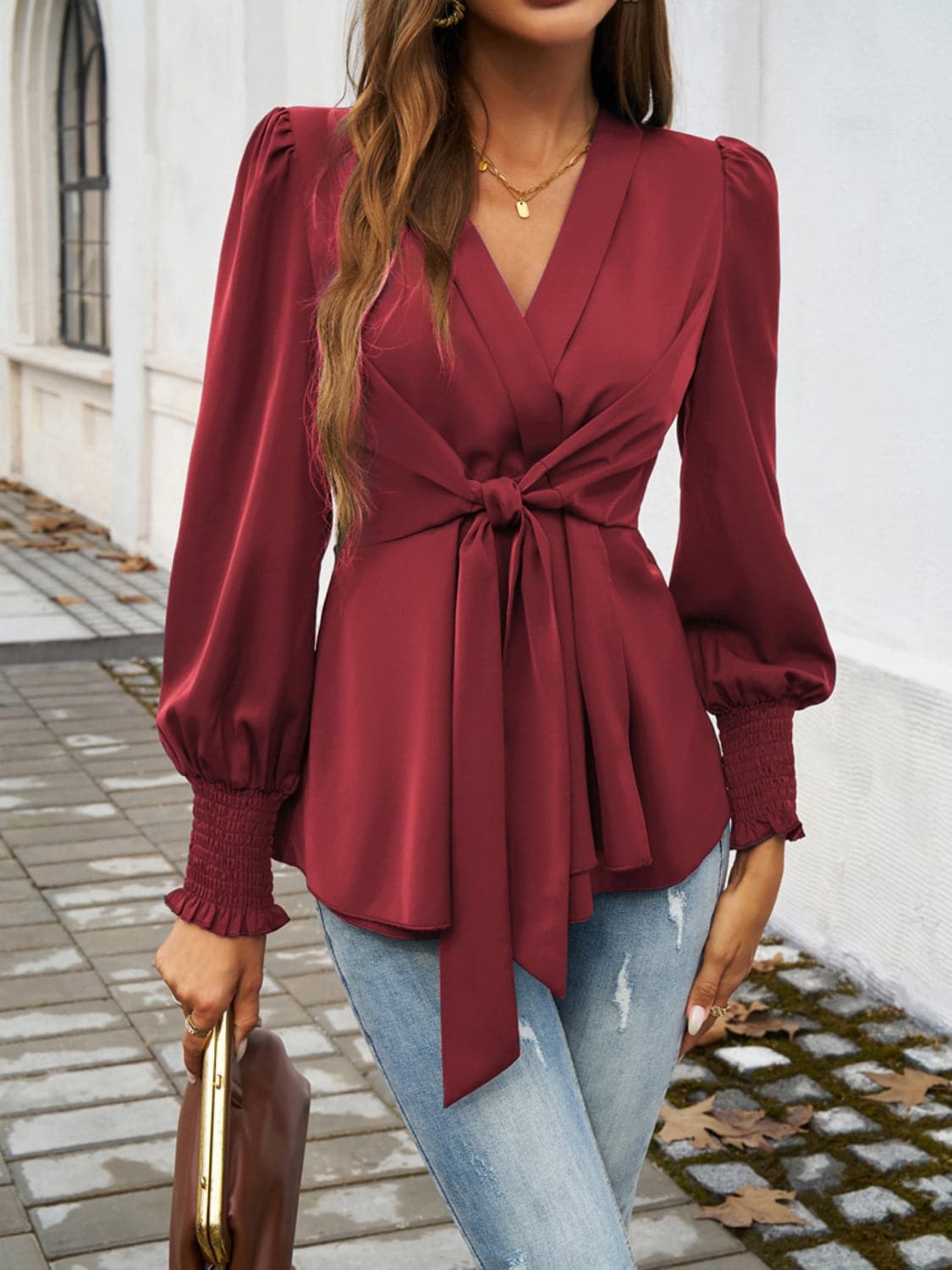 Smocked Surplice Long Sleeve Blouse.