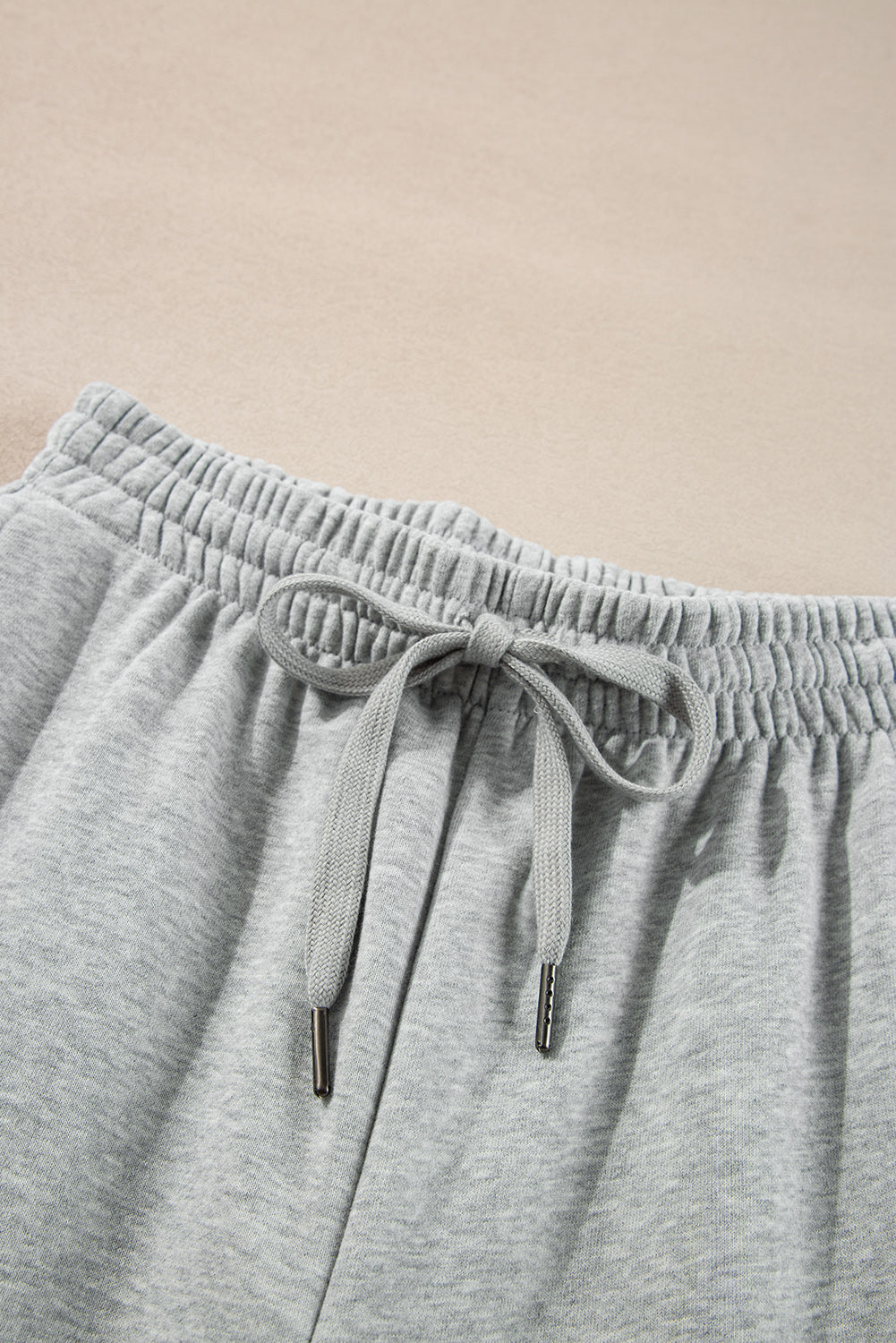 Cozy light grey fleece-lined joggers with adjustable drawstring waist