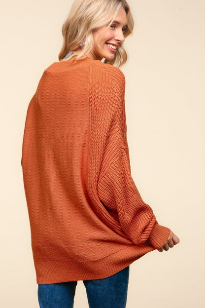 Chic textured asymmetric sweater with side slits