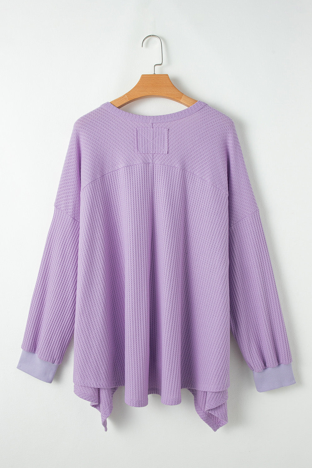 Flattering orchid petal plus size waffle knit top with exposed seams