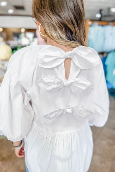 Chic white blouse with bow knot and cutout back design