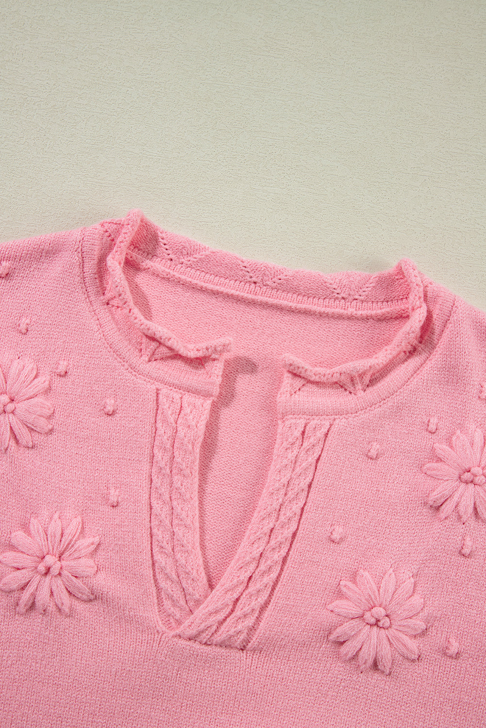 Peach blossom floral knitted sweater with notched neckline