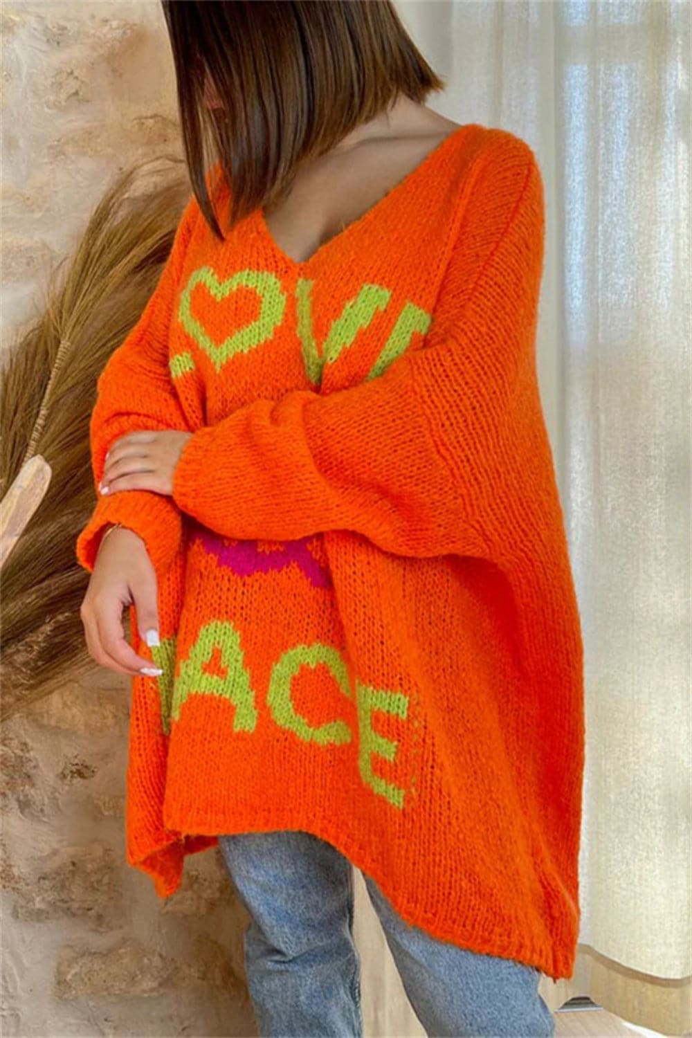 Peace Graphic V-Neck Long Sleeve Sweater.