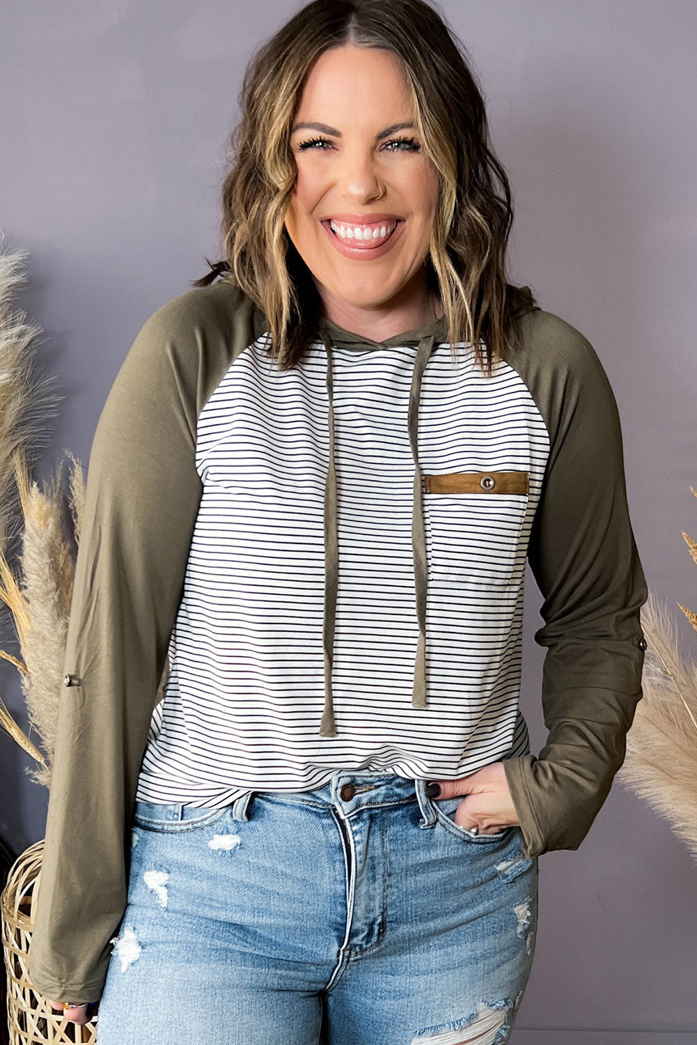 Green striped plus size hoodie with raglan sleeves and buttoned pocket