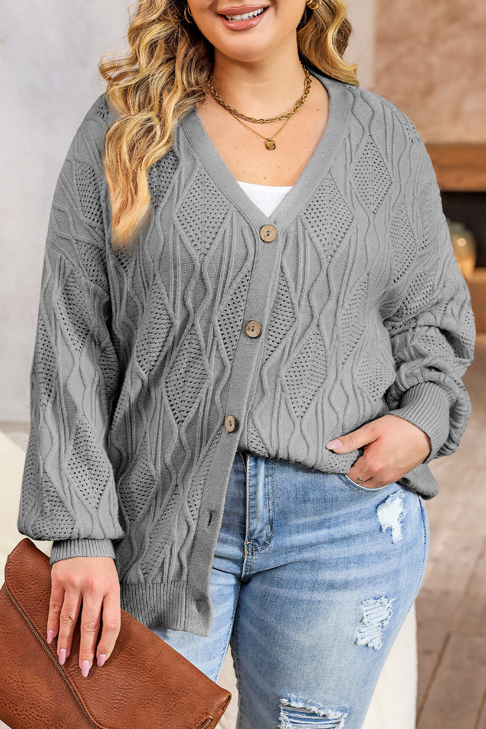 Chic gray plus size knitted cardigan with hollow-out details and button front