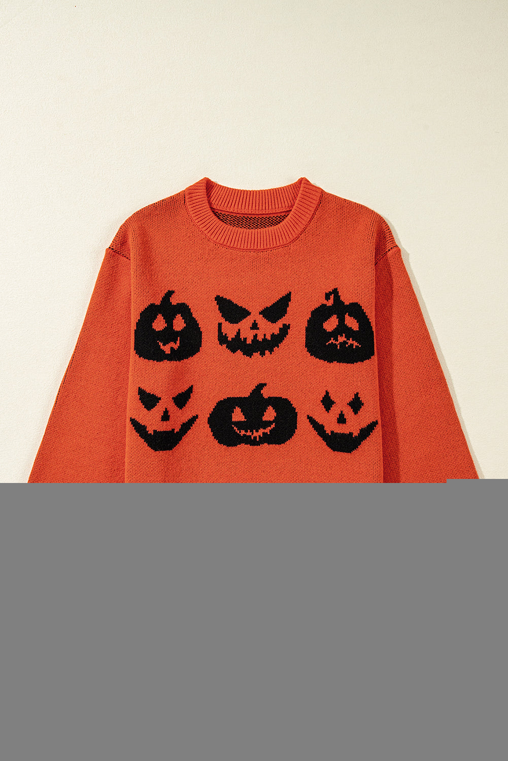 Spooky pumpkin face drop shoulder sweater for Halloween fun