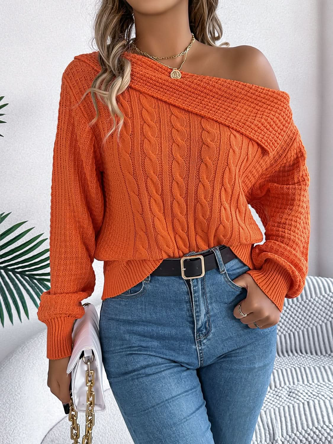 Asymmetrical cable-knit long sleeve sweater